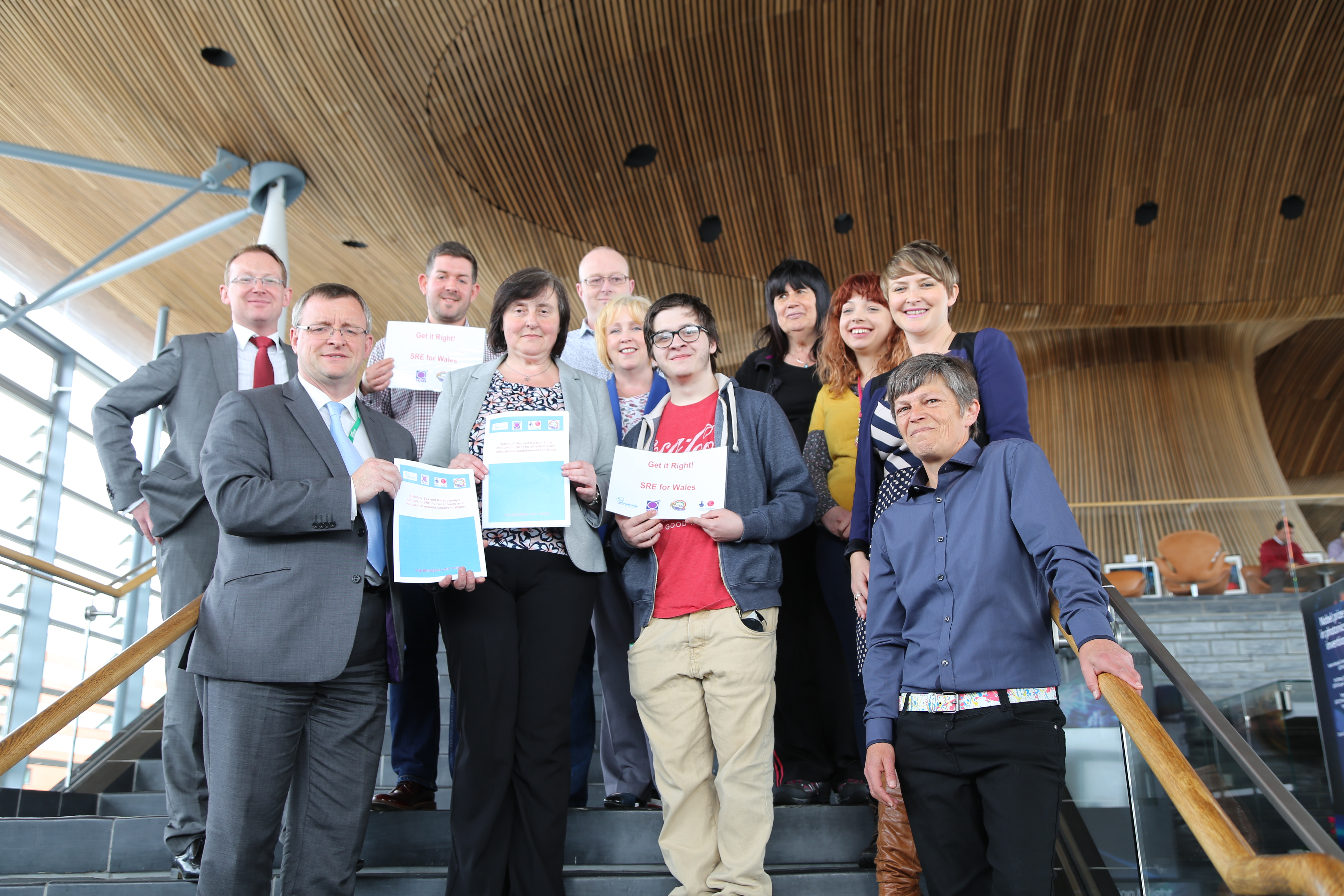 William Powell, Bethan Jenkins and Russell George AM accept the petition from petitioners on the steps of the Senedd