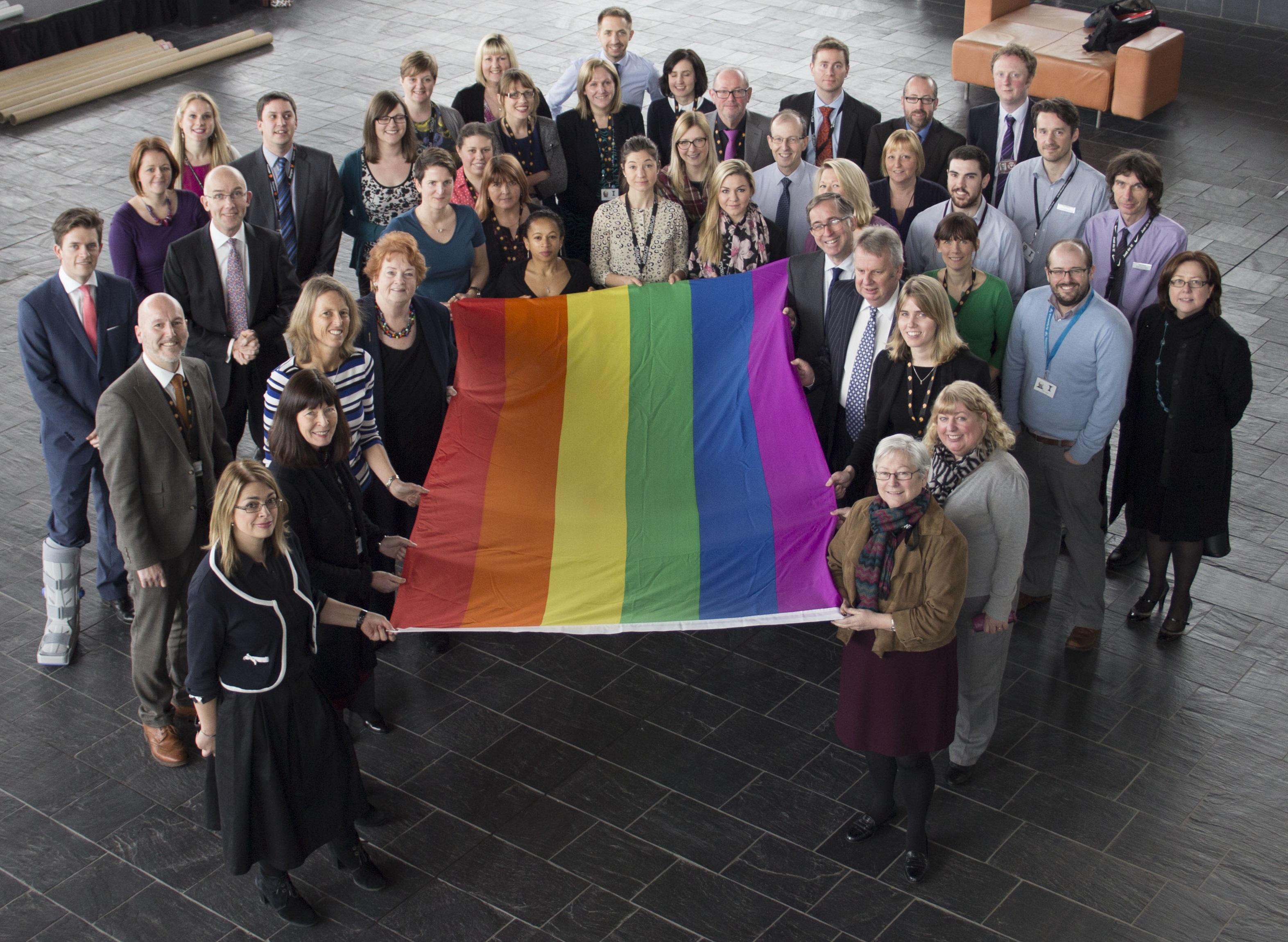 Assembly staff holding the equality flag / Staff y Cynulliad yn dal y faner cydraddoldeb 