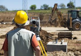 Picture of a construction worker building a road.