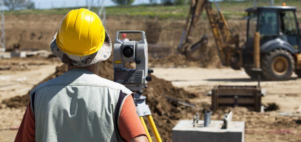 Picture of a construction worker building a road.