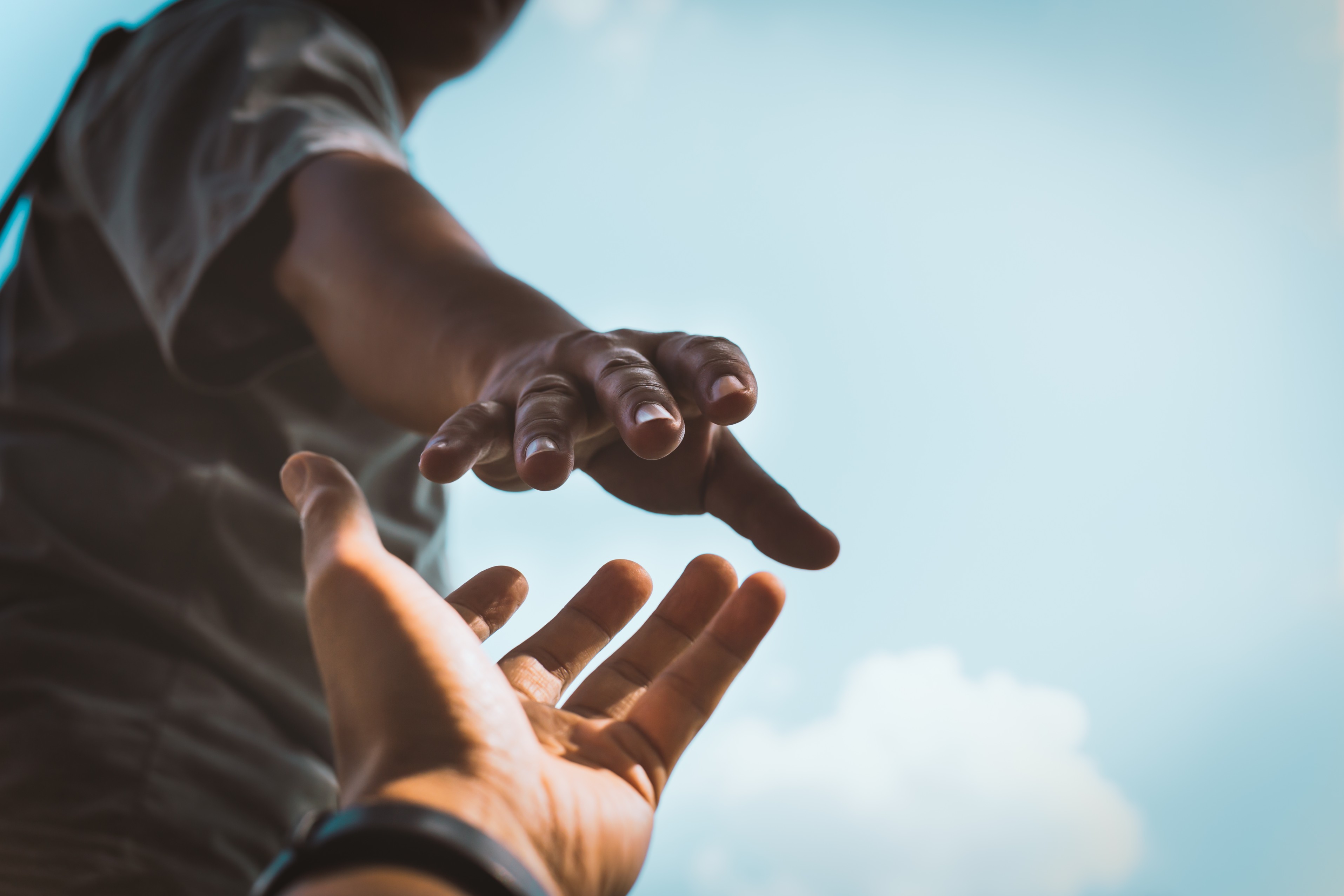 Image Of Hands Reaching Out To Help Each Other