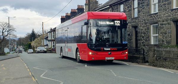 Picture of the T22 Trawscymru bus service passing through a village 