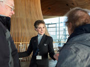 A tour guide showing people around in the Senedd