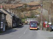 A bus passing through Llangynog in Powys