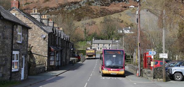 A bus passing through Llangynog in Powys