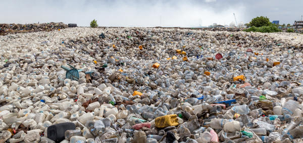 Main image: A landscape photograph of plastic items discarded in landfill.