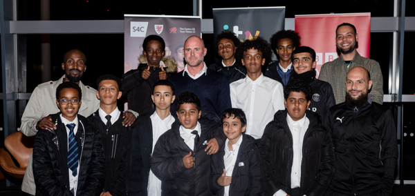 Rob Page and players from the Tiger Bay Juniors football club
