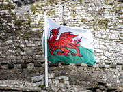 The cover image is of a Welsh flag flying in front of a castle wall.