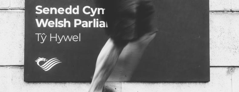 Greyscale legs by Ty Hywel sign