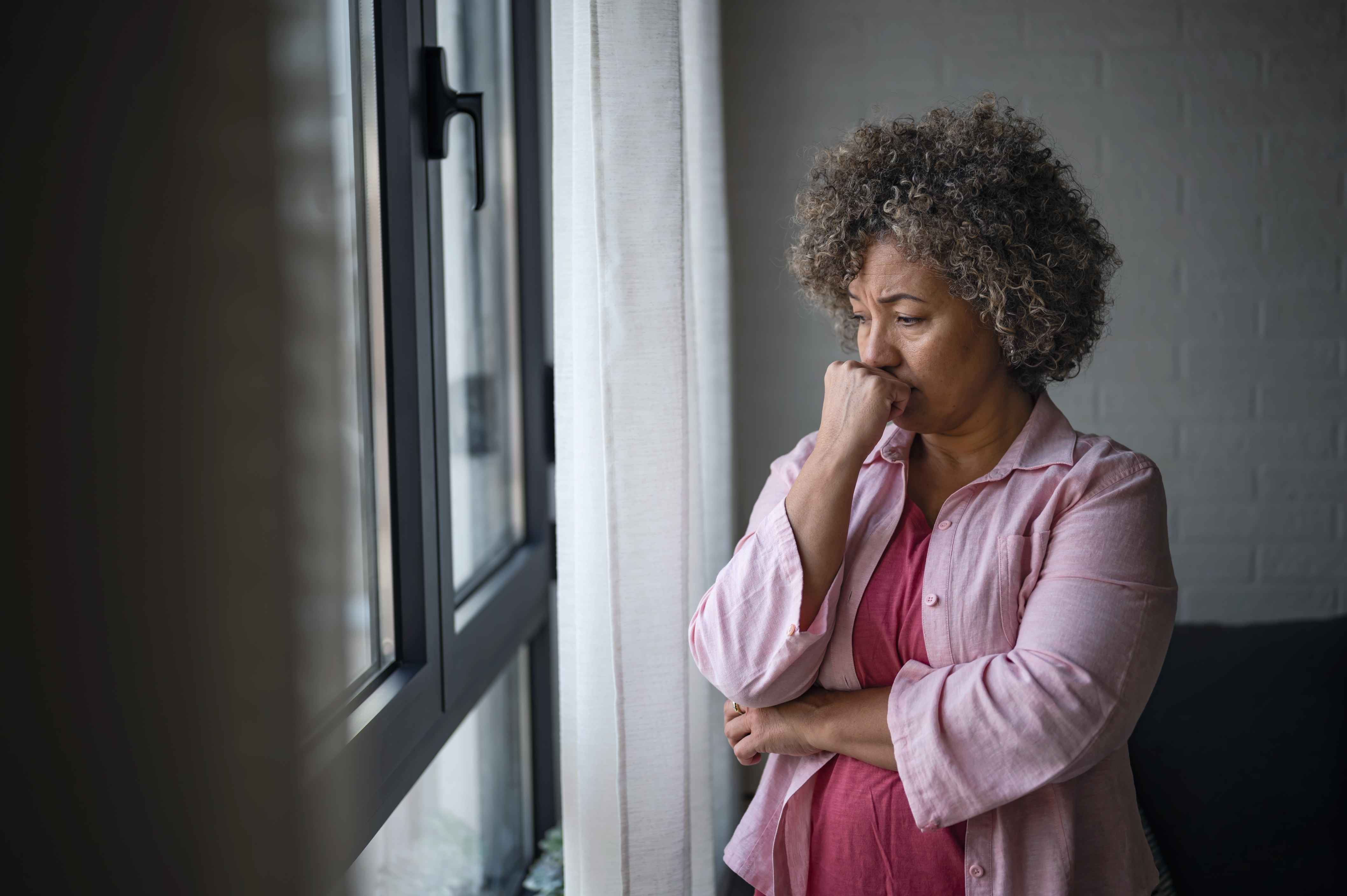 Woman looking out of window