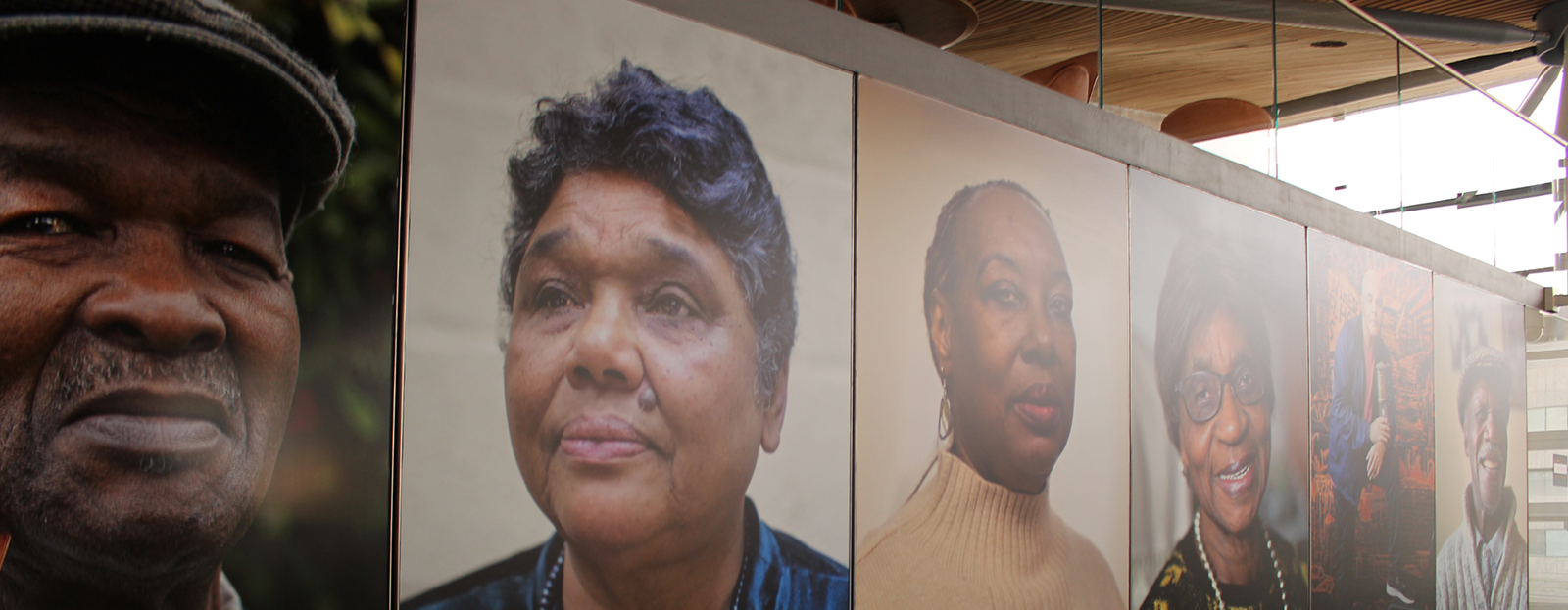 Portraits of people from the Windrush exhibition in the Senedd