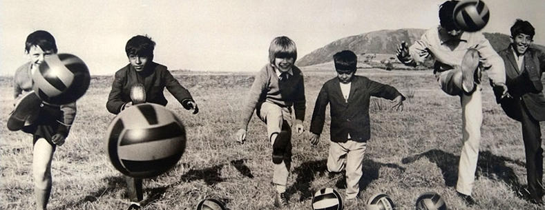 Children bonding at Tonfanau Camp with the international language of football.