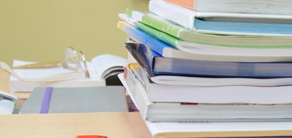 Image of school books on a desk 