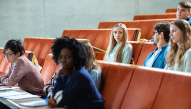 Students sitting in a lecture hall.