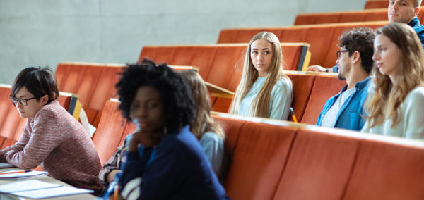 Students sitting in a lecture hall.