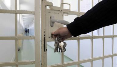 A prison gate being locked