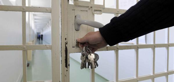 A prison gate being locked