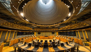 The Senedd chamber from inside looking up to the light outside.