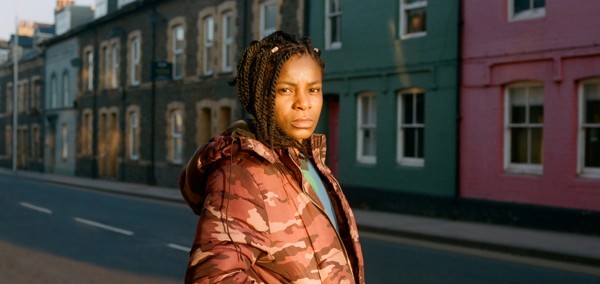 A young woman standing in a street