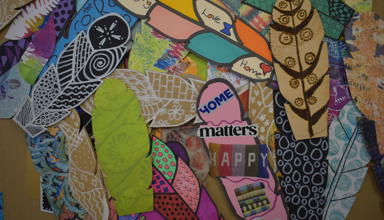 A collection of member’s feathers designed with decorative symbols and meaningful messages and images of hope. 