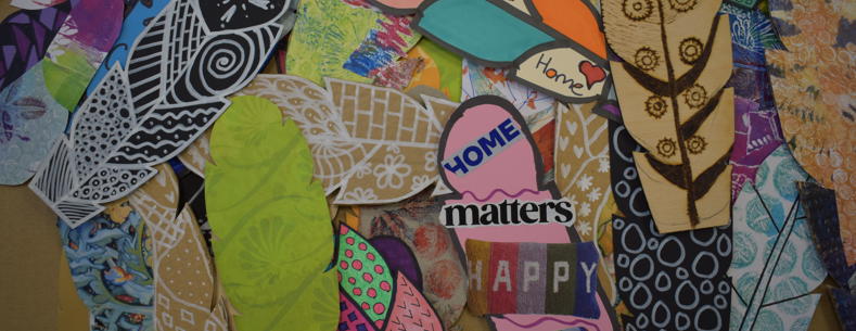 A collection of member’s feathers designed with decorative symbols and meaningful messages and images of hope.