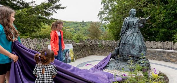 The statue of Cranogwen, created by Sculptor Sebastien Boyesen, was unveiled in Llangrannog by village children on 10 June 2024.