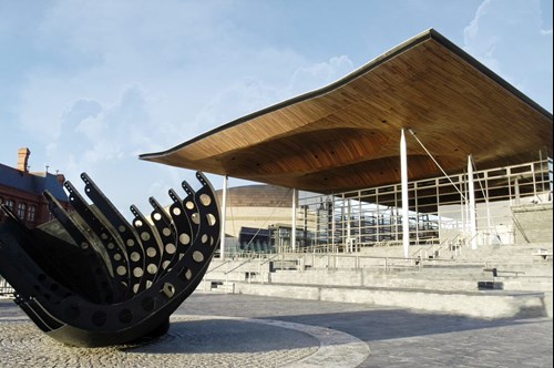 The Senedd Building from a front facing view including the boat statue