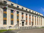 A picture of the outside of the government building in Cathays. The Welsh, UK and Ukraine flags are visible.