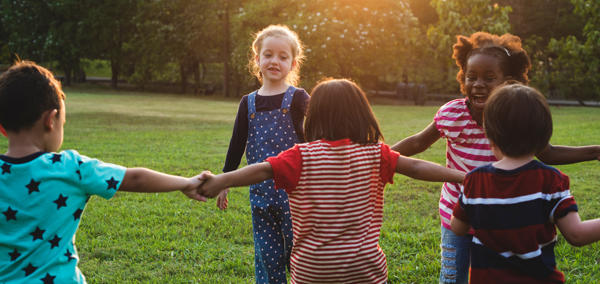 Children holding hand in a circle