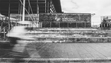 blurry cyclist outside the Senedd