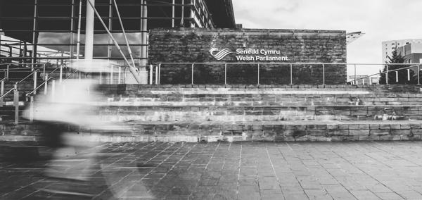 blurry cyclist outside the Senedd