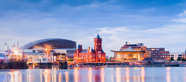 An image of Cardiff Bay including the Senedd and Pierhead buildings.